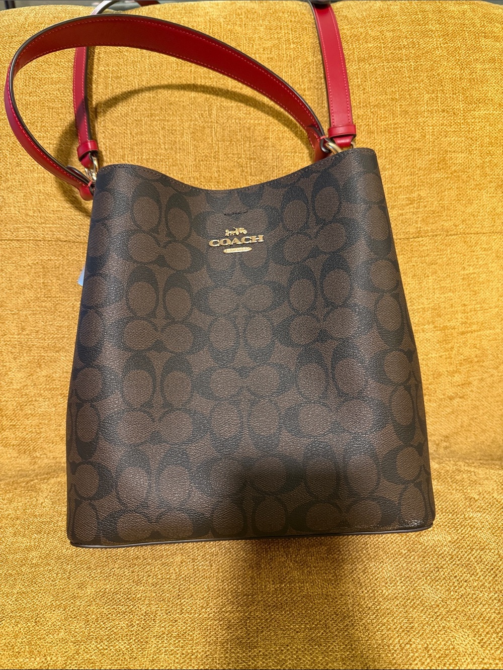Coach Brown Signature Canvas Bucket Bag with Red Strap